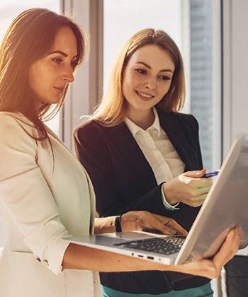 two colleagues working on laptop