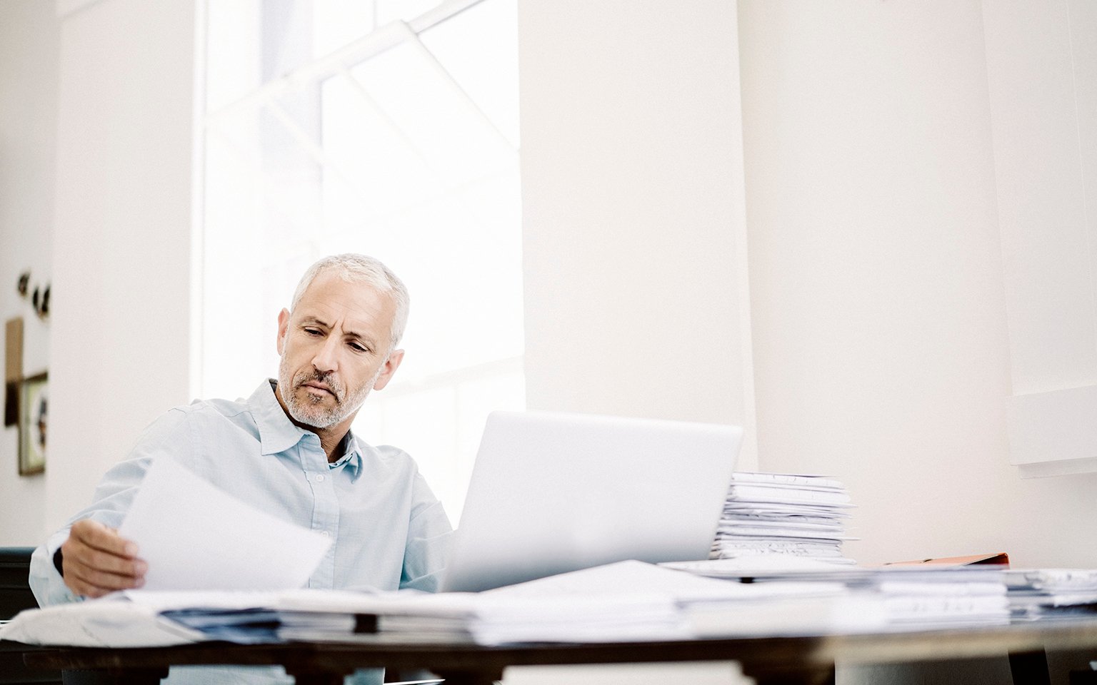 man looking at papers