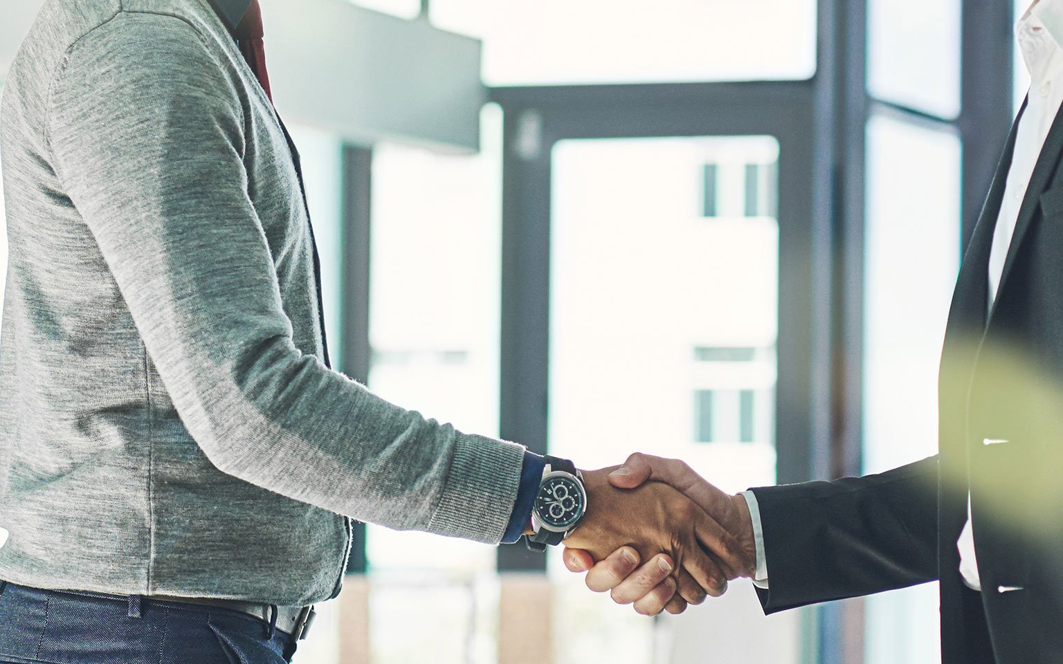 two men shaking hands