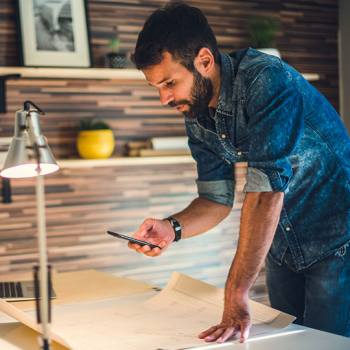 designer taking photos with mobile phone