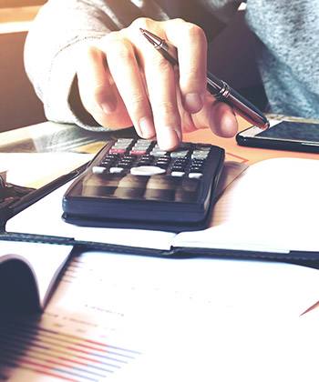 close up of working on a calculator