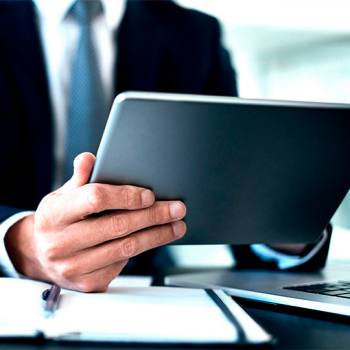 Kyocera Net Manager man looking into his tablet